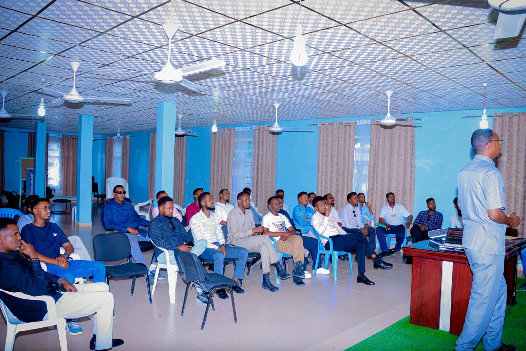 Wide view of the Borama training hall with participants and facilitator